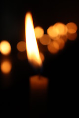 Fototapeta premium burning candle in the dark