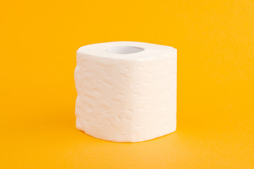 Toilet paper roll on a yellow background.