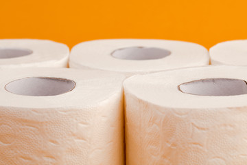 Toilet paper roll on a yellow background.