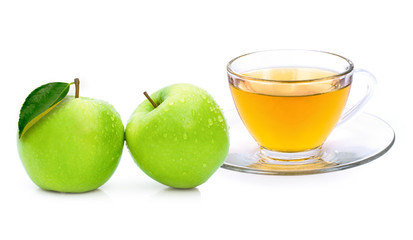 Closeup cup glass of apple cider tea and fresh ripe granny smith green apples fruit isolated on white background. 