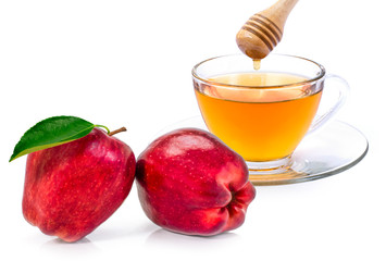  glass of apple cider tea and fresh ripe red apple fruit with honey isolated on white background. 