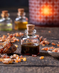 A bottle of myrrh essential oil with myrrh resin