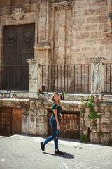 young man standing in front of a church