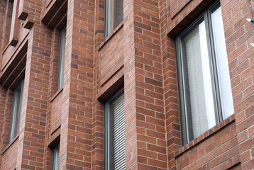Detail of a brick facade of a building.