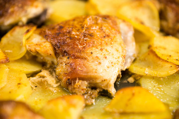 Chips and meat, some details out of focus. Fried poultry