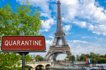 Quarantine sign with Eiffel tower in Paris, France. Warning about epidemic quarantine in France. Coronavirus disease. COVID-2019 alert sign