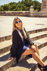 young executive woman sit on the stairs