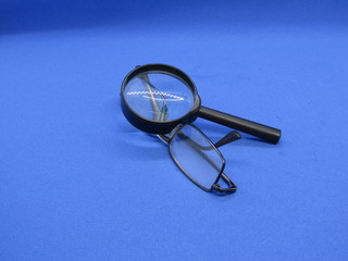 Fototapeta premium Glasses for improving vision and magnifying glass.