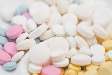 Fototapeta na wymiar colored pills close background and texture