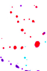 Close Up of Multicoloured Splattered Paint Blobs on White Paper for Abstract Background