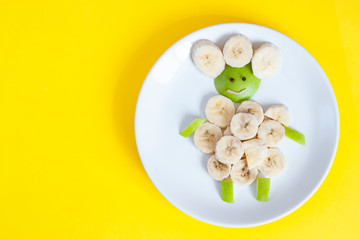 Creative food. Banana and apple lamb. Children's snack healthy fruits.