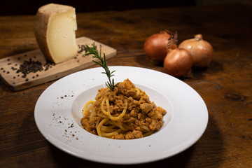 Pici Senesi of fresh pasta with Cinta Senese pork sauce with Rosemary from the table of an old...