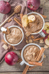 Quick autumn dessert idea. Autumn apple pie mugcake with red apples, cinnamon, spices, Rustic...