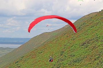 Paraglider flying above Rhossili	