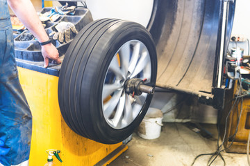 car mechanic changing tire