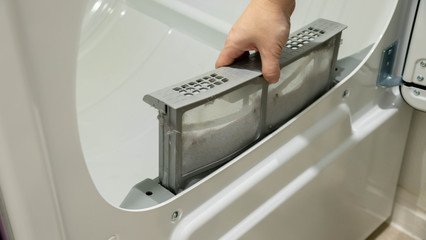 Pulling out the lint catcher