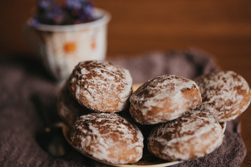 gokra gingerbread on a saucer with a mug out of focus