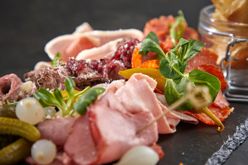 meat appetizers on the black background
