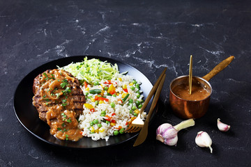 fried hamburger steaks with onion gravy and salad