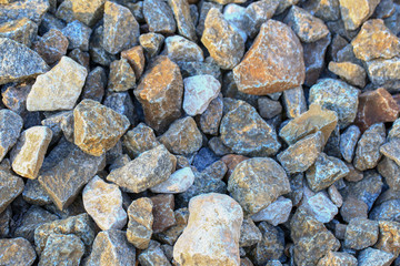 The stones. Gravel. Granite crushed stone. Close-up.