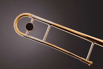 Tuning slide part of a trombone with gray gradient background