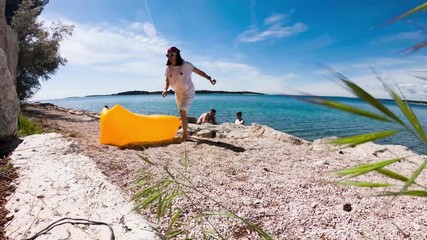 people resting in summer sunny day at sea beach - Powered by Adobe