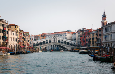 Fototapeta na wymiar Venice, Italy - February 18, 2020: The Rialto Bridge (Ponte di Rialto), the oldest of the four bridges spanning the Grand Canal in Venice, Italy. 