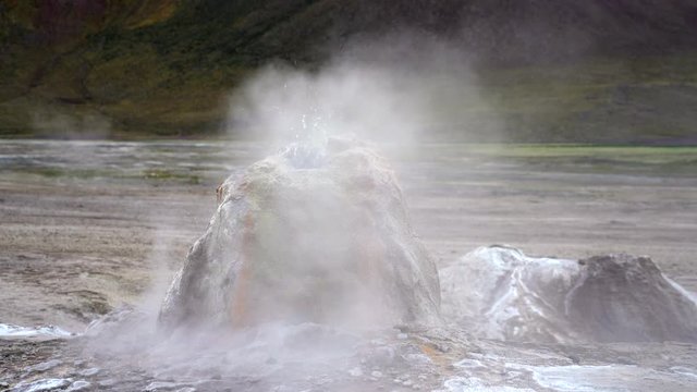 Close up shot of gurgling geyser cone at El Tatio, the third-largest geothermal field in the world, located in the Atacama desert in northern Chile near the border with Bolivia.