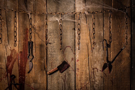 Torture tools on wood background