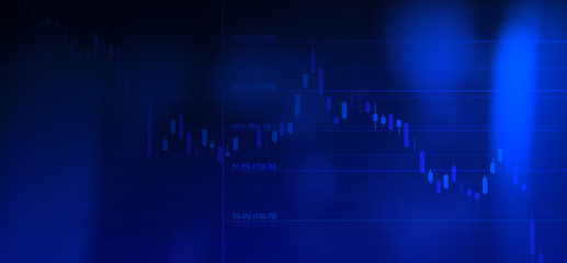Stock exchange market or business financial graph on computer monitor with blue background color, copyspace for texture