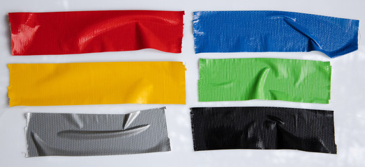 Set of red, gray, blue, yellow, green tapes on white background. Torn horizontal and different size...