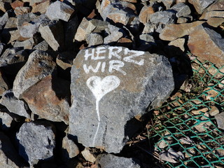 stones with heart in the water