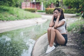 Beautiful thai woman very sad from unrequited love,She rethink and think over about love,vintage style,dark tone,broken heart,asian girl