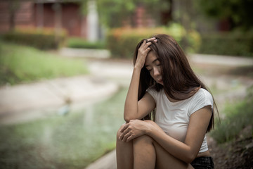 Obraz premium Beautiful thai woman very sad from unrequited love,She rethink and think over about love,vintage style,dark tone,broken heart,asian girl