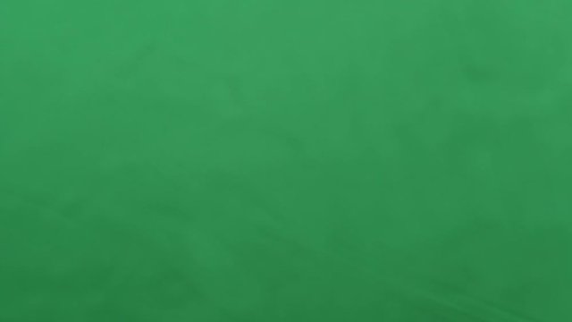 potato chips in free fall on a green background. Slow motion. Pringles