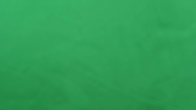 potato chips in free fall on a green background. Slow motion. Pringles