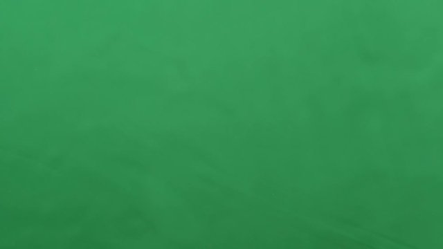 potato chips in free fall on a green background. Slow motion. Pringles