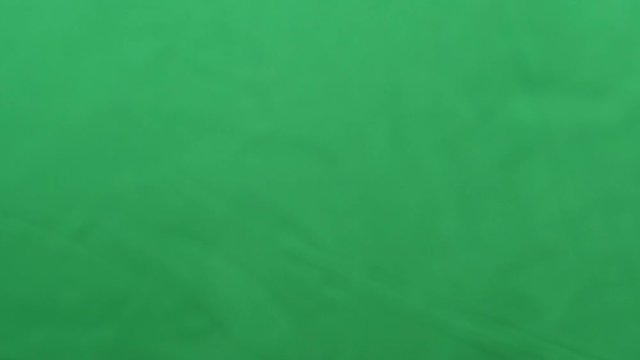 potato chips in free fall on a green background. Slow motion. Pringles