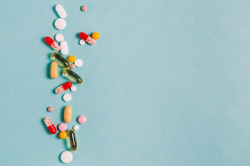 Antiviral pills, antibiotics, capsules, vitamins, healthy lifestyle concept, medical background with place for text top view