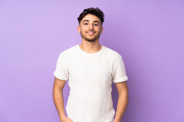 Arabian handsome man over isolated background laughing