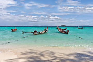 Fototapeta na wymiar Boats at Sunrise Beach, Koh Lipe, Thailand, Asia