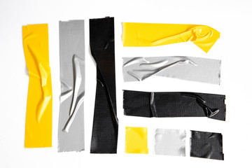 Set of yellow, gray, black tapes on white background. Torn horizontal and different size sticky...