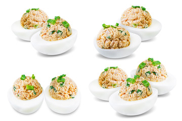 Canned Tuna deviled eggs with scallion on a white isolated background