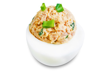 Canned Tuna deviled eggs with scallion on a white isolated background