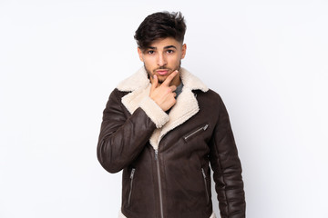 Arabian handsome man over isolated background thinking