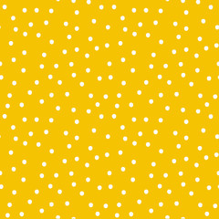 Seamless yellow polka dot background pattern