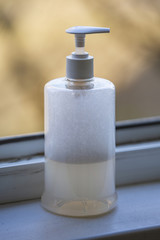 Fototapeta na wymiar Plastic bottle with dispenser with foam antiseptic liquid