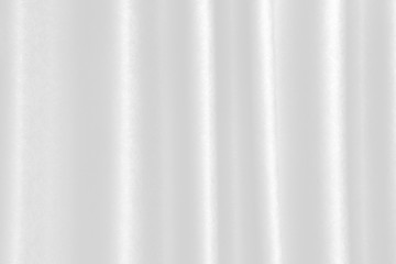 Obraz premium luxurious wavy white fabric texture surface curtain wave with a pattern background. macro texture of white striped fabric