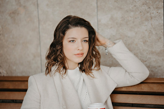Beautiful young brunette girl close portrait looking in camera