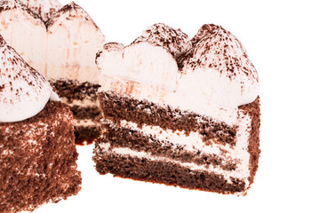 A piece of chocolate-coffee cake with cocoa on a white background